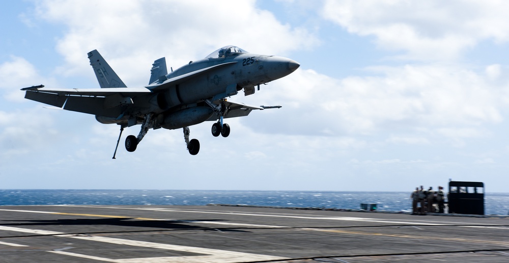 Aircraft depart and land aboard USS John C. Stennis