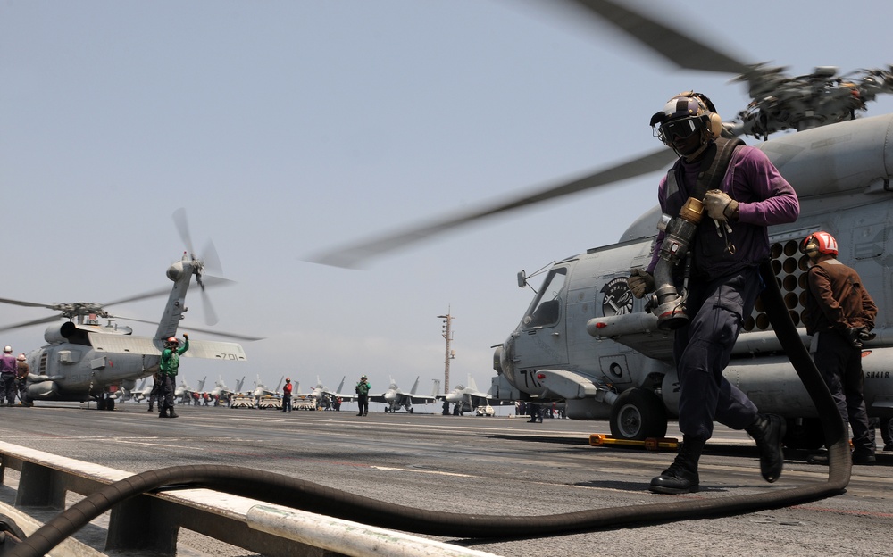 USS Abraham Lincoln sailors at work