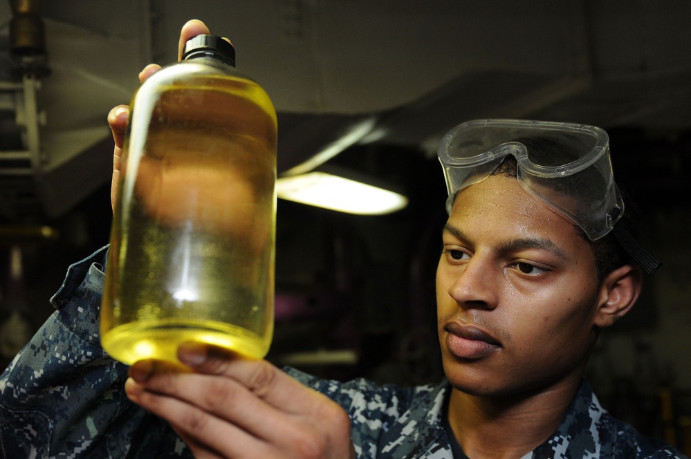 USS Abraham Lincoln sailors at work