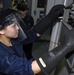 USS Abraham Lincoln sailor performs maintenance