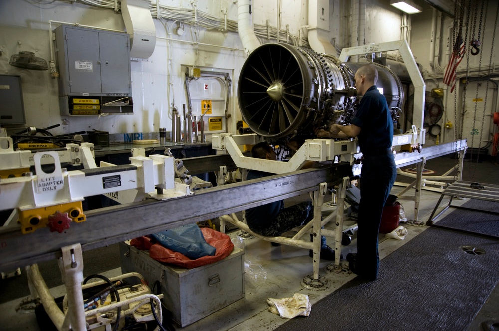 USS Abraham Lincoln performs maintenance on engine