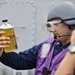 USS Porter sailor checks fuel