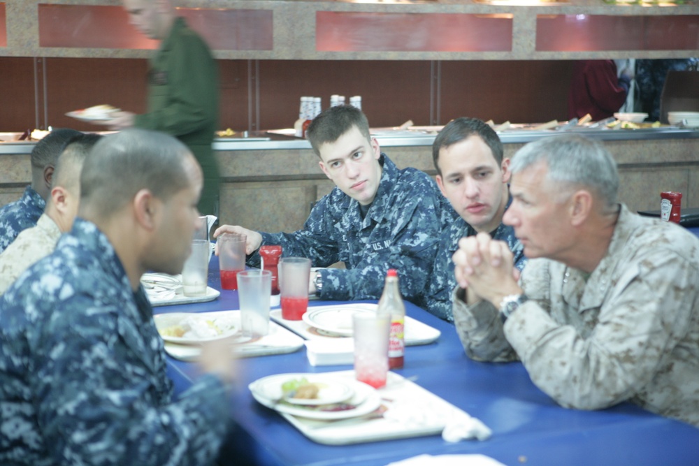 Commanding general and senior enlisted leader from 4th Marine Air Wing chat with Marines and sailors aboard the Iwo Jima during African Lion 2012