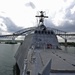 USS Independence passes under Bridge of the Americas