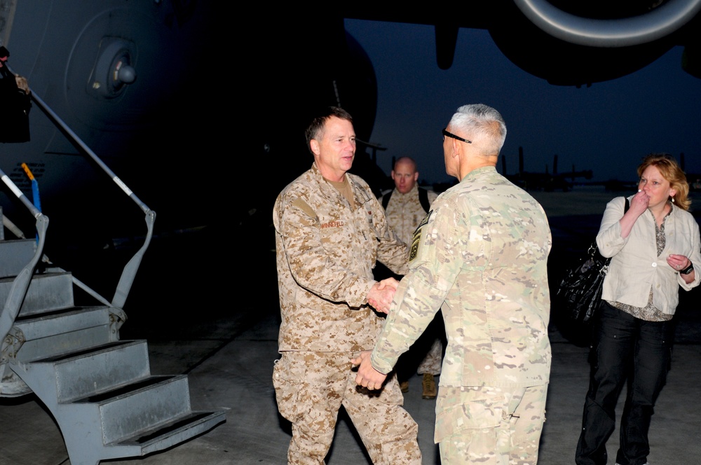 Adm. Winnefeld is being greeted by Maj. Gen. Huggins