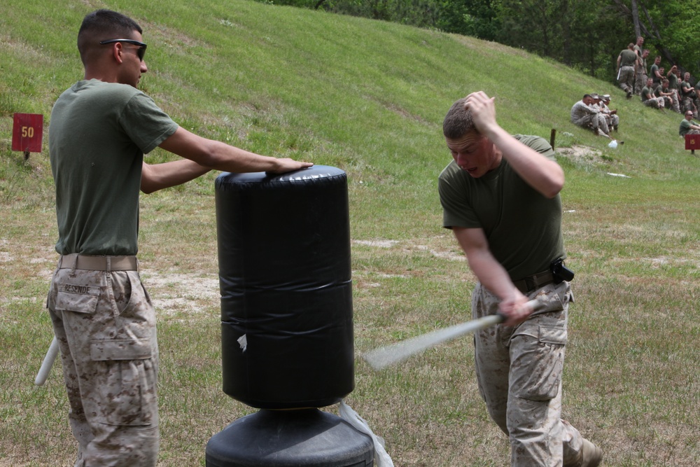 APS-12: Ground Combat Element pushes through pain of OC during Non-Lethal Weapons and Tactics training