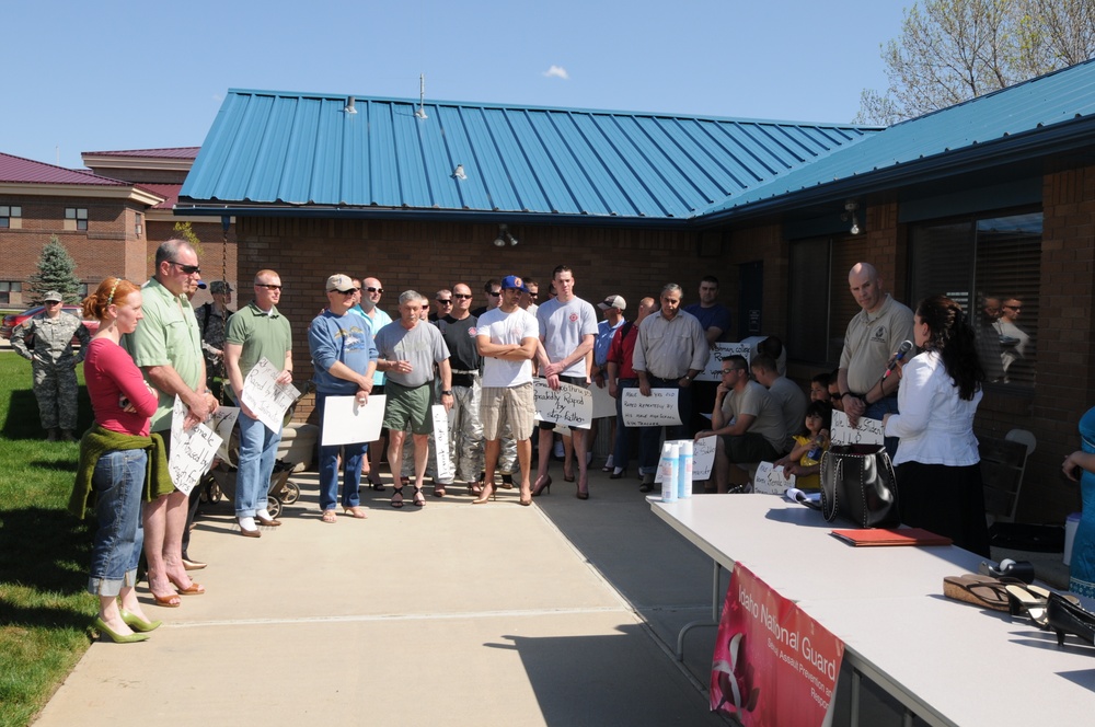 Idaho Guardsmen walk  in her shoes for a cause