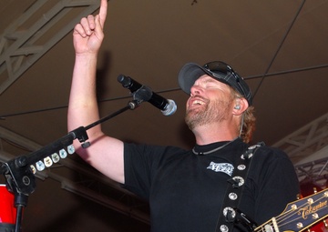 Playing to the base: Toby Keith sings at Camp Buehring during his 'Live In Overdrive' USO tour