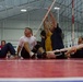 Members of Team Navy/Team Coast Guard practice sitting volleyball for the 2012 Warrior Games.