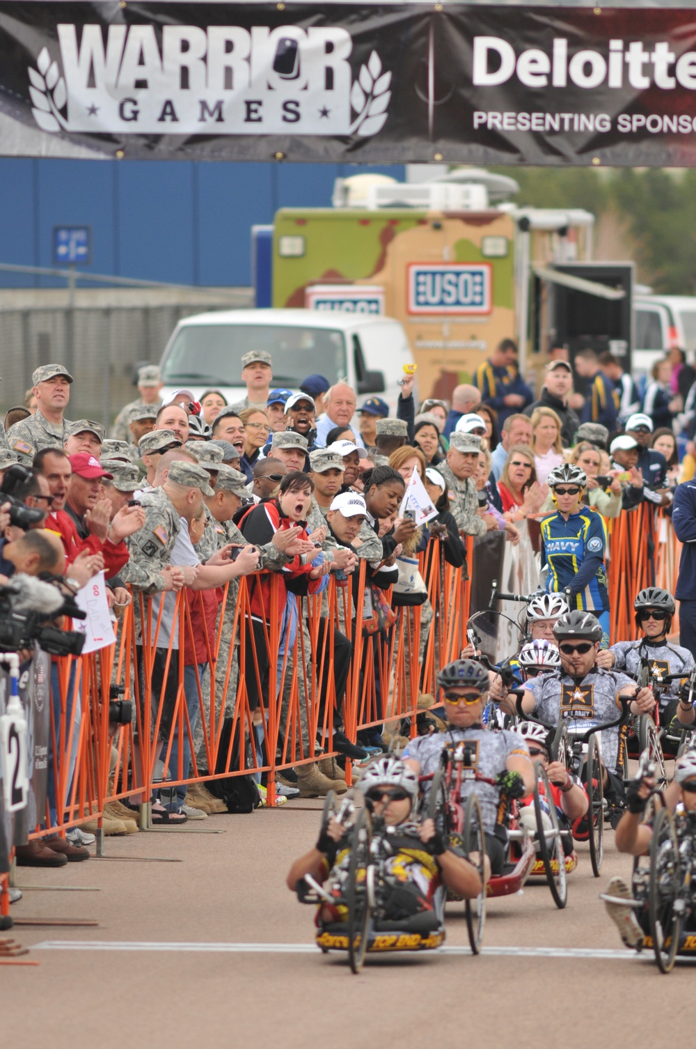 Cheering fans encourage wounded warriors
