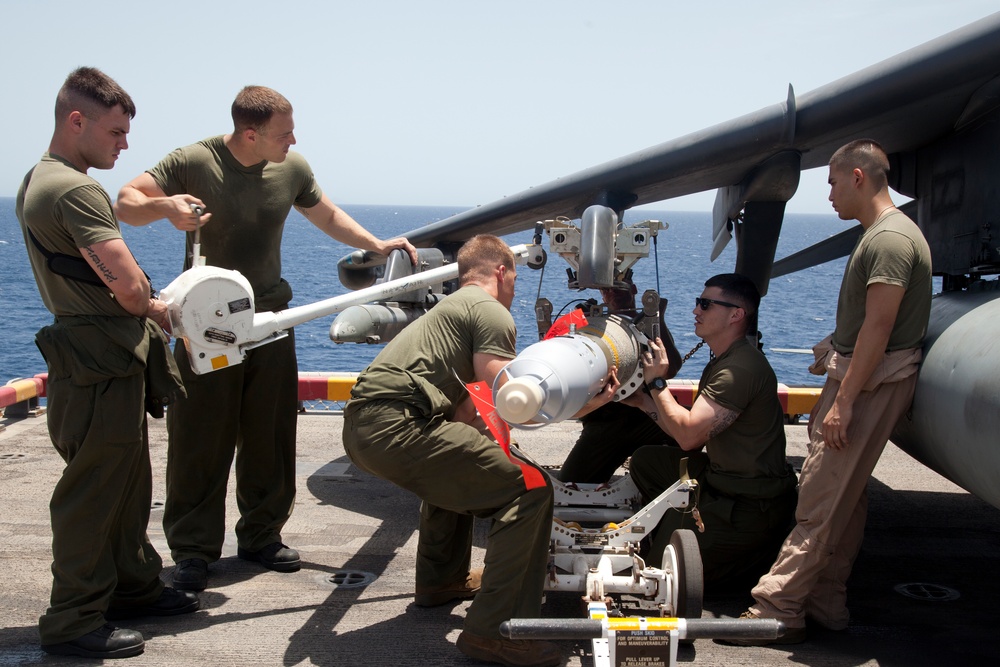 Marines load ordnance aboard USS Makin Island