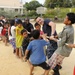 Blue Ridge sailors play games and music with Cambodian children
