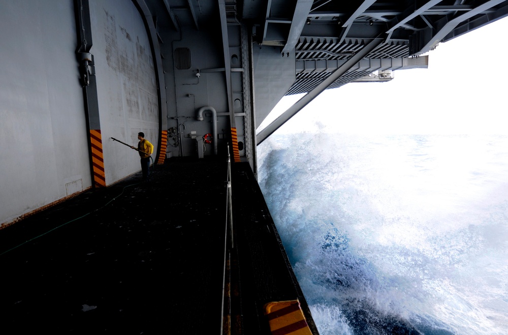 USS Carl Vinson sailor performs corrosion control