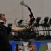 Army archer Sgt. Fred Prince fires