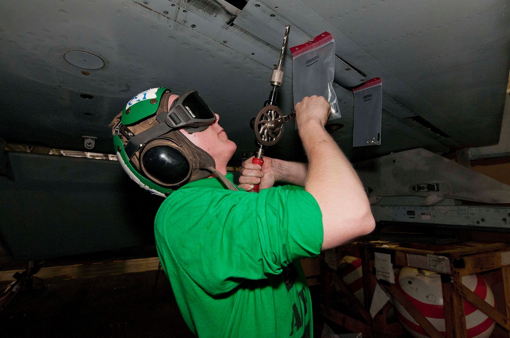 USS Dwight D. Eisenhower sailor conducts maintenance