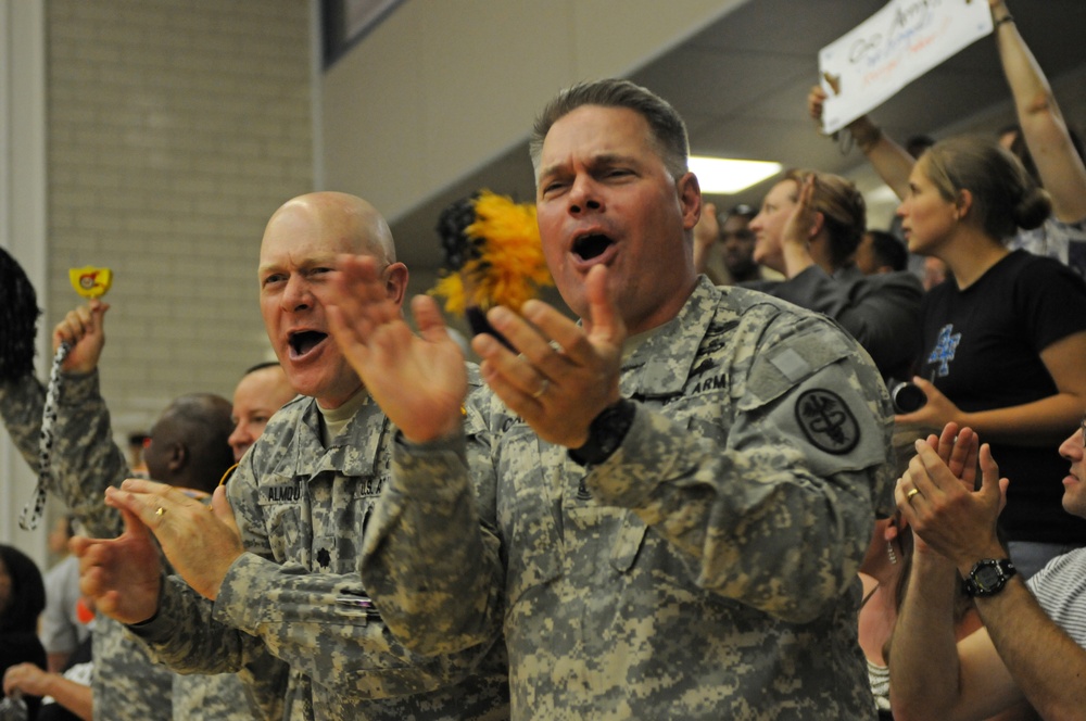 Lt. Col. Brian Almquist and Command Sgt. Maj. Eugene Chance cheer on the US Army sitting volleyball team at Warrior Games 2012