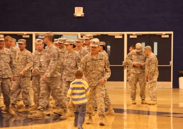 Guardsmen return from a year long deployment in Africa