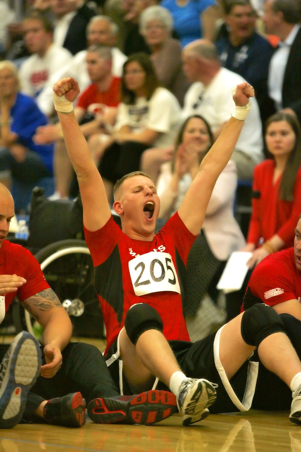 Palmer, Mass., Marine competes in sitting volleyball