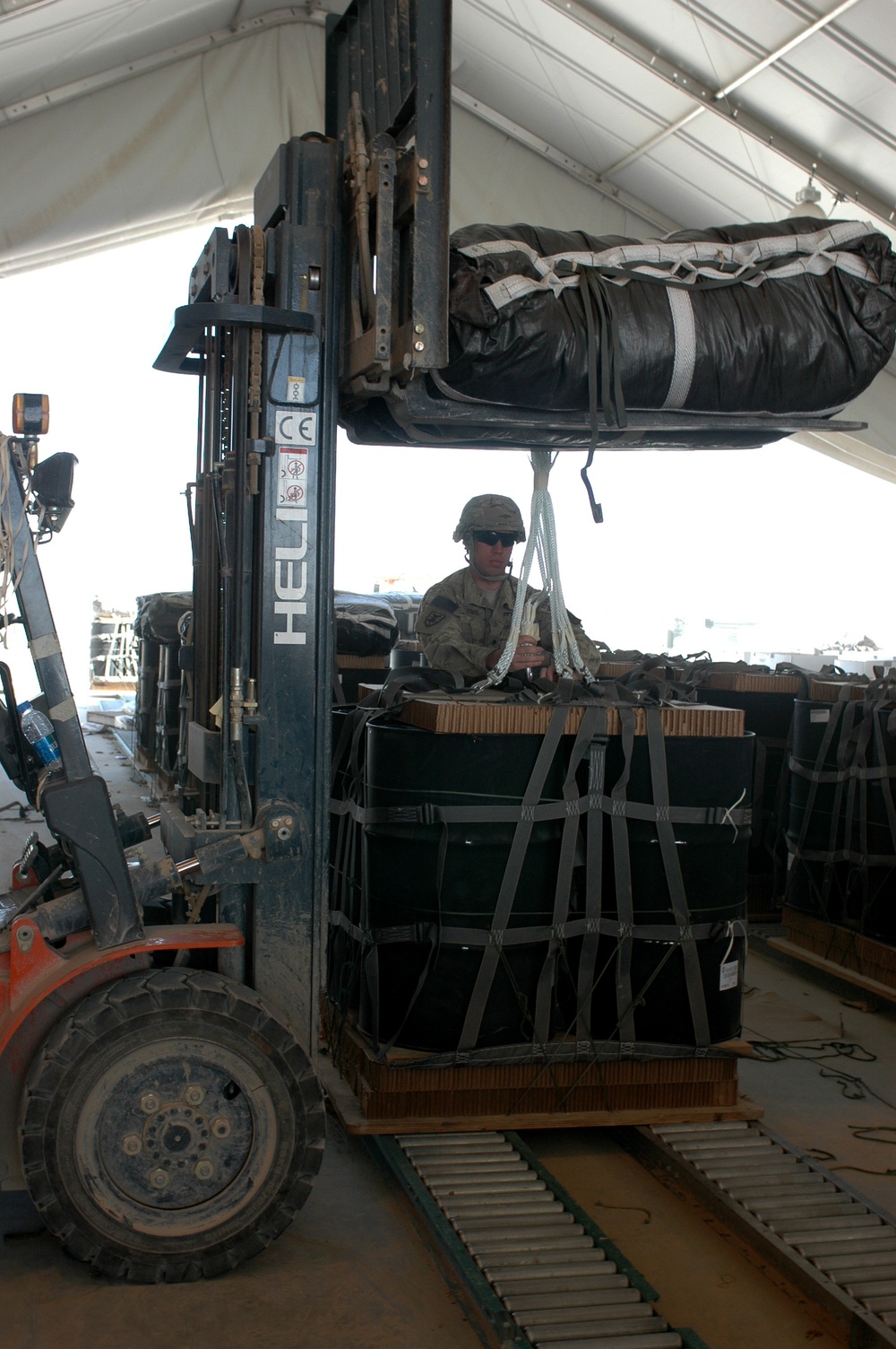 Riggers of 623rd QM help keep vehicles off of the road and out of harm’s way