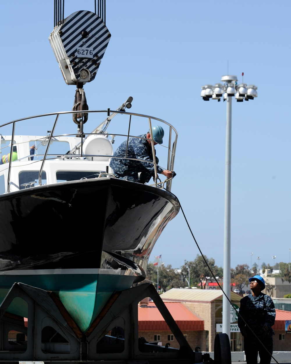 Sailors prepare admiral's barge