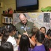 Mark Calderon shows students his gold medal