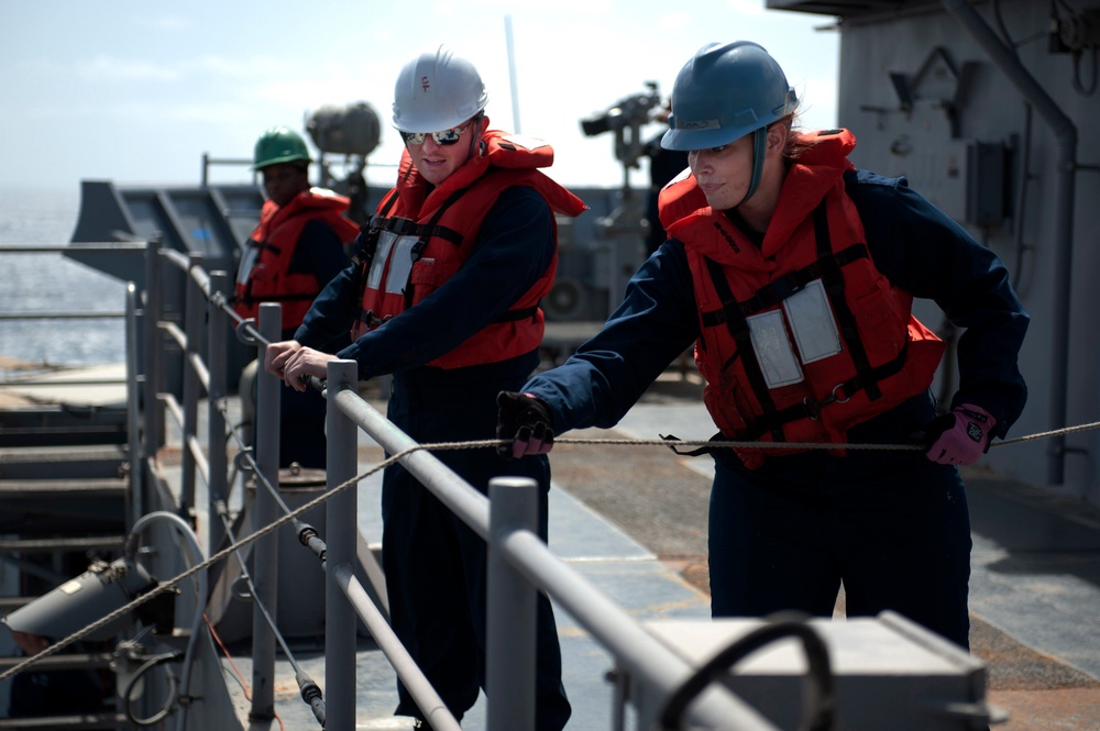 USS Pearl Harbor sailors at work