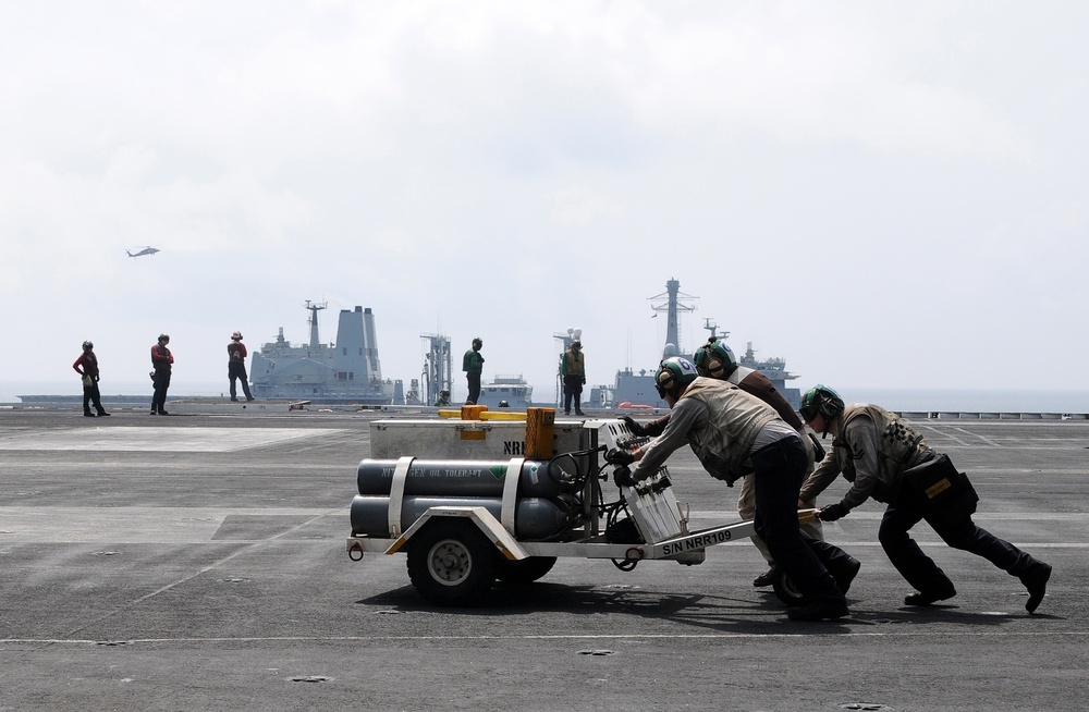 USS Abraham Lincoln sailors push nitrogen cart