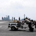 USS Abraham Lincoln sailors push nitrogen cart