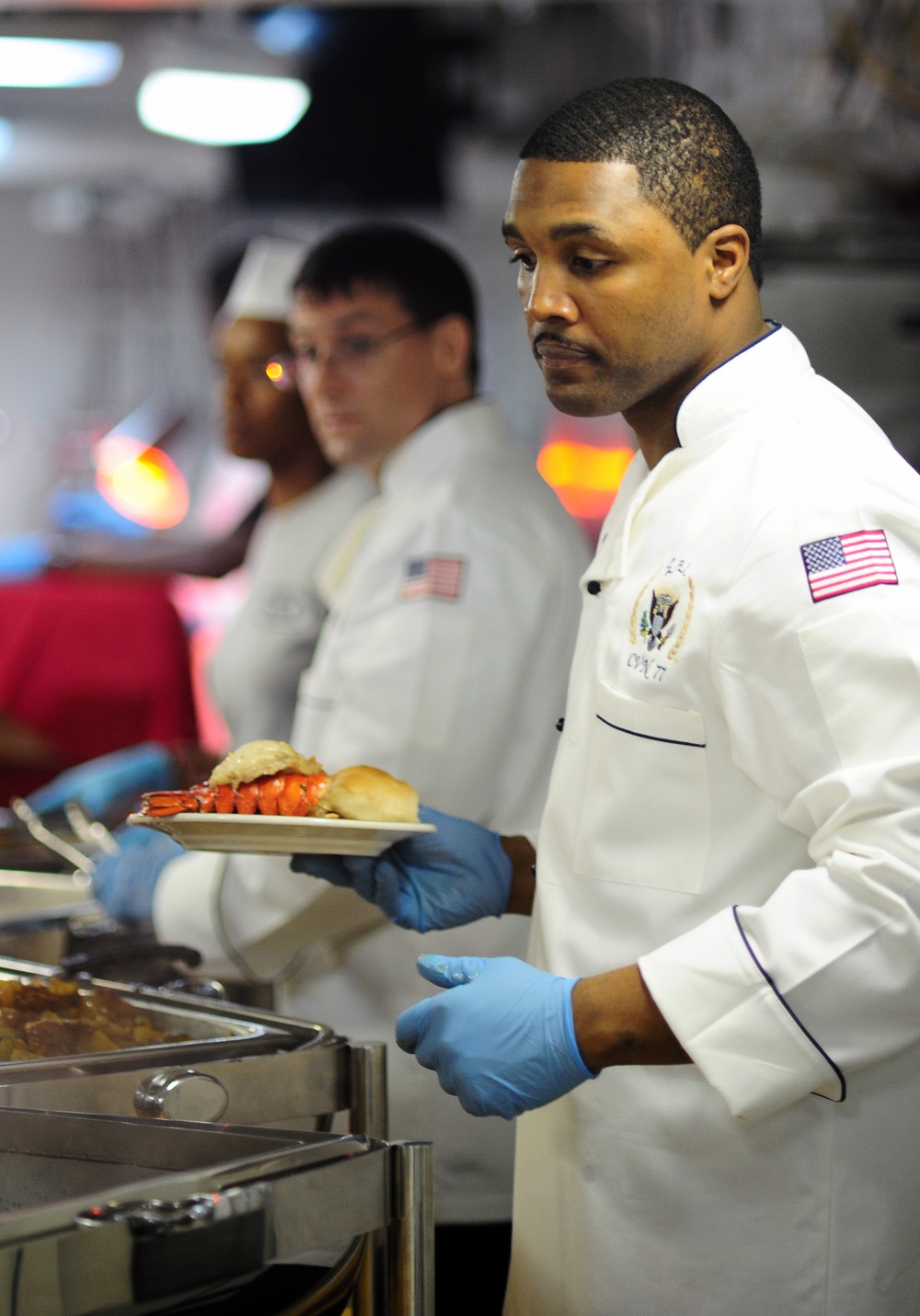 USS George H.W Bush sailor serves dinner