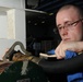 USS George H.W. Bush sailor cleans nozzle