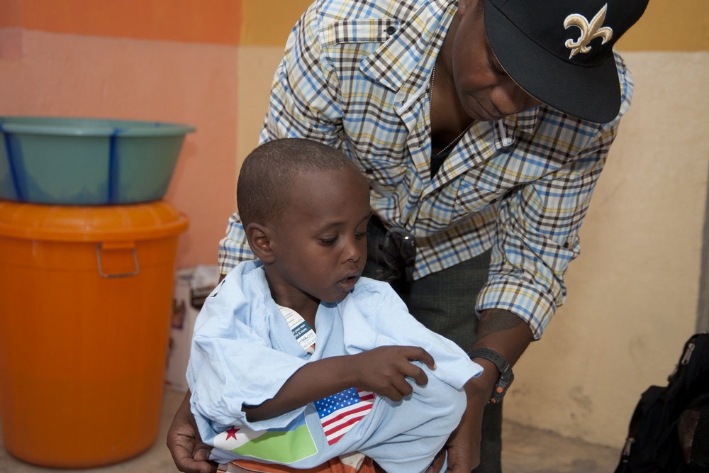 Camp Lemonnier volunteer group distributes school supplies to Djiboutian kids