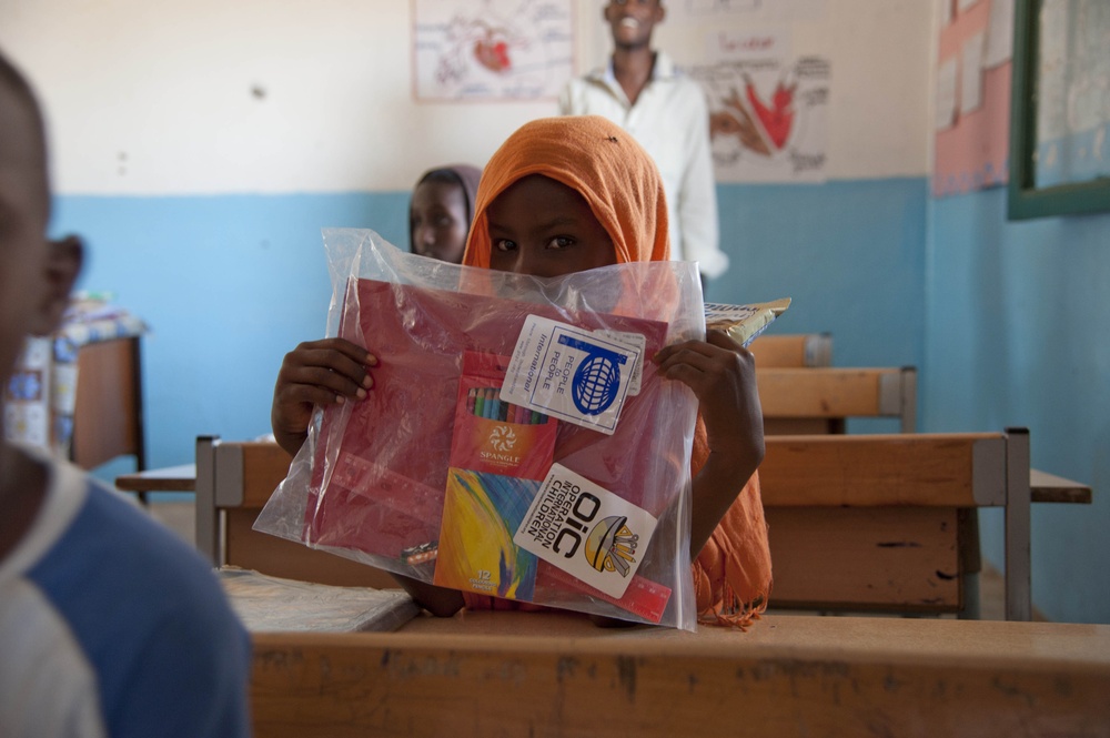 Camp Lemonnier volunteer group distributes school supplies to Djiboutian kids