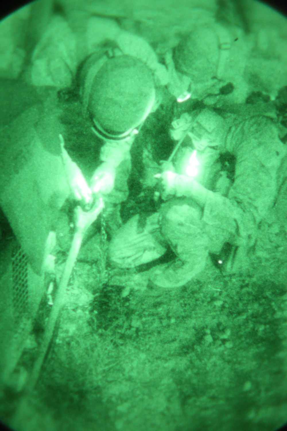 Helicopter Support Team conducts night operations via sling load