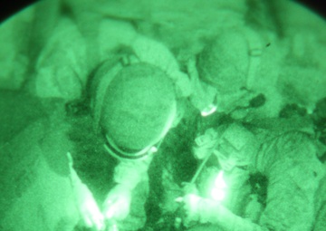 Helicopter Support Team conducts night operations via sling load