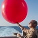 Releasing a weather balloon