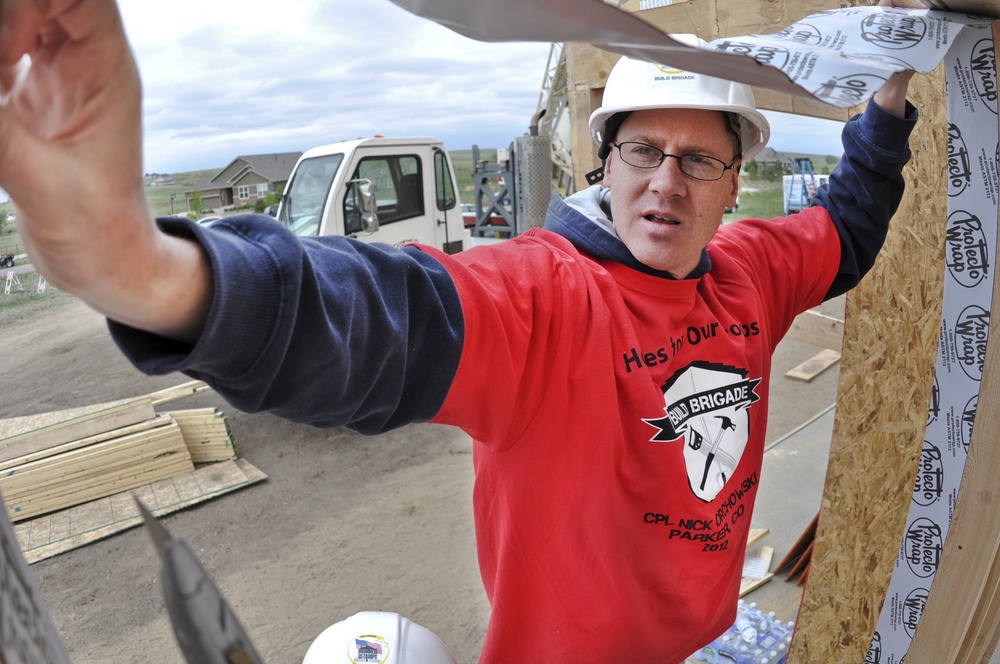 Buckley service members support home construction for injured vet