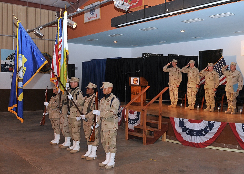 Camp Lemonnier color guard parade the colors during a change of command ceremony for Camp Lemonnier