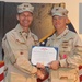 Capt. Scott Hurst (right) receives a Legion of Merit from his time as Camp Lemonnier commanding officer at the Camp Lemonnier change of command ceremony