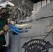 USS Abraham Lincoln sailor applies name to helicopter