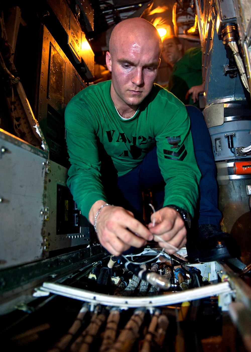 USS Enterprise sailor repairs cable