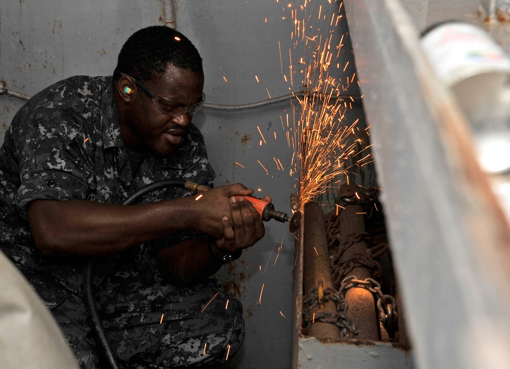 USS Abraham Lincoln sailor at work