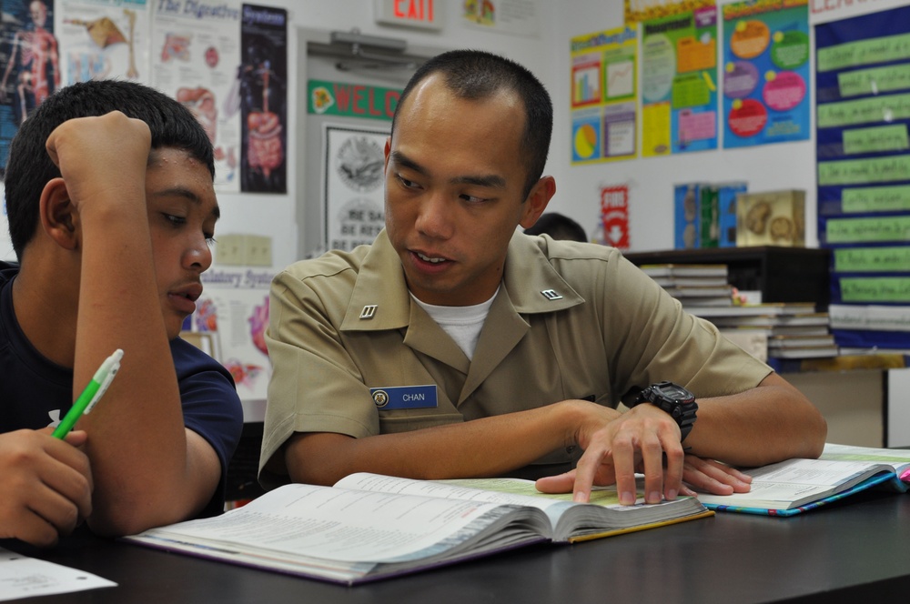 USS Emory S. Land sailors tutors students