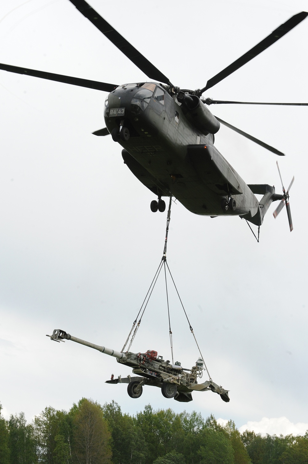 Live air assault artillery raid by slingloaded M777A2 howitzers using German CH53 cargo helicopters