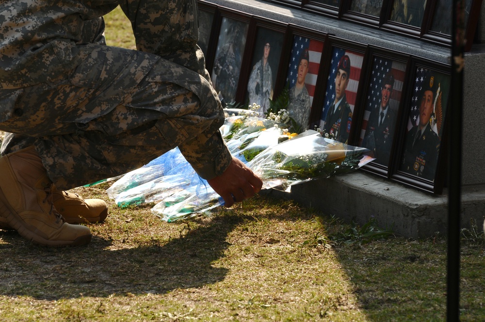 Laying flowers on memorial