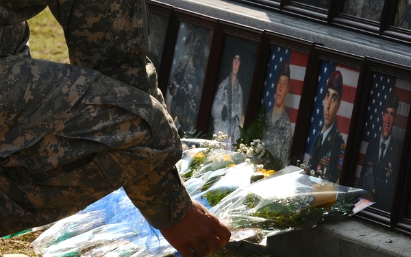 Laying flowers on memorial