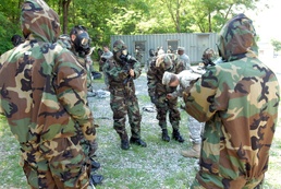 Soldiers from the 19th ESC go through the gas chamber