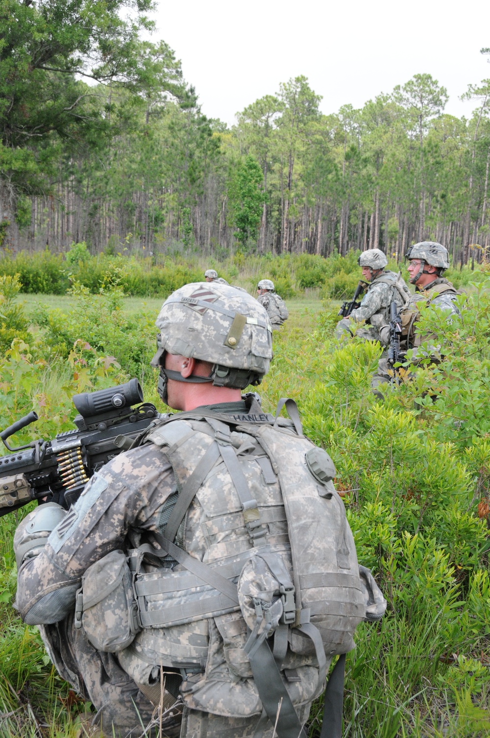 Infantrymen fire into platoon-level training