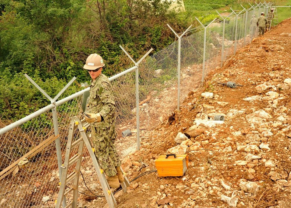 Navy Seabees construct perimeter fence for SR12