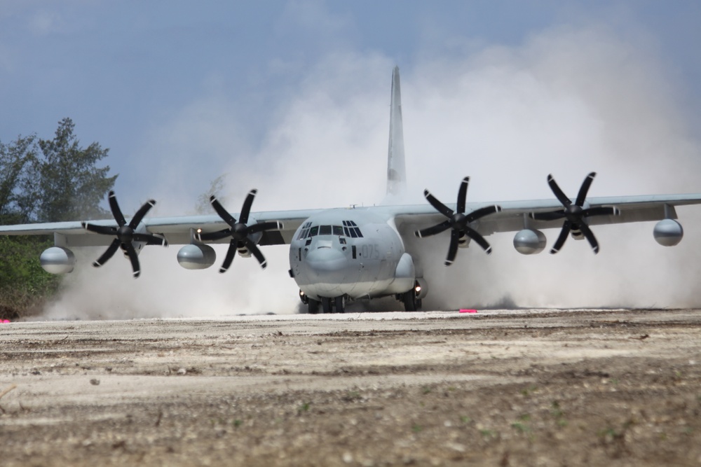 A KC-130J Hercules aircraft lands on Tinian Island's North Field runway