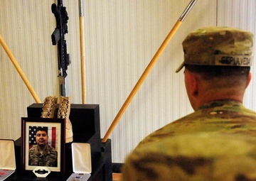 Charlie Company, 1st Battalion 41st Infantry Regiment pay respects to fallen comrade